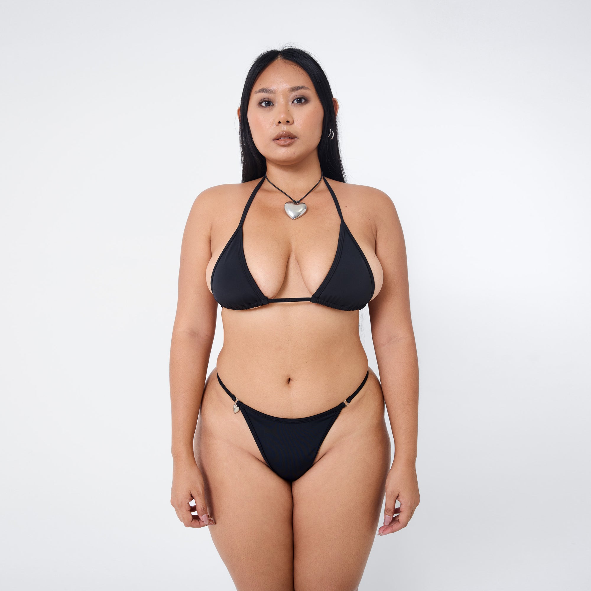 Arthur Apparel strappy bikini bottom in black with silver heart charm