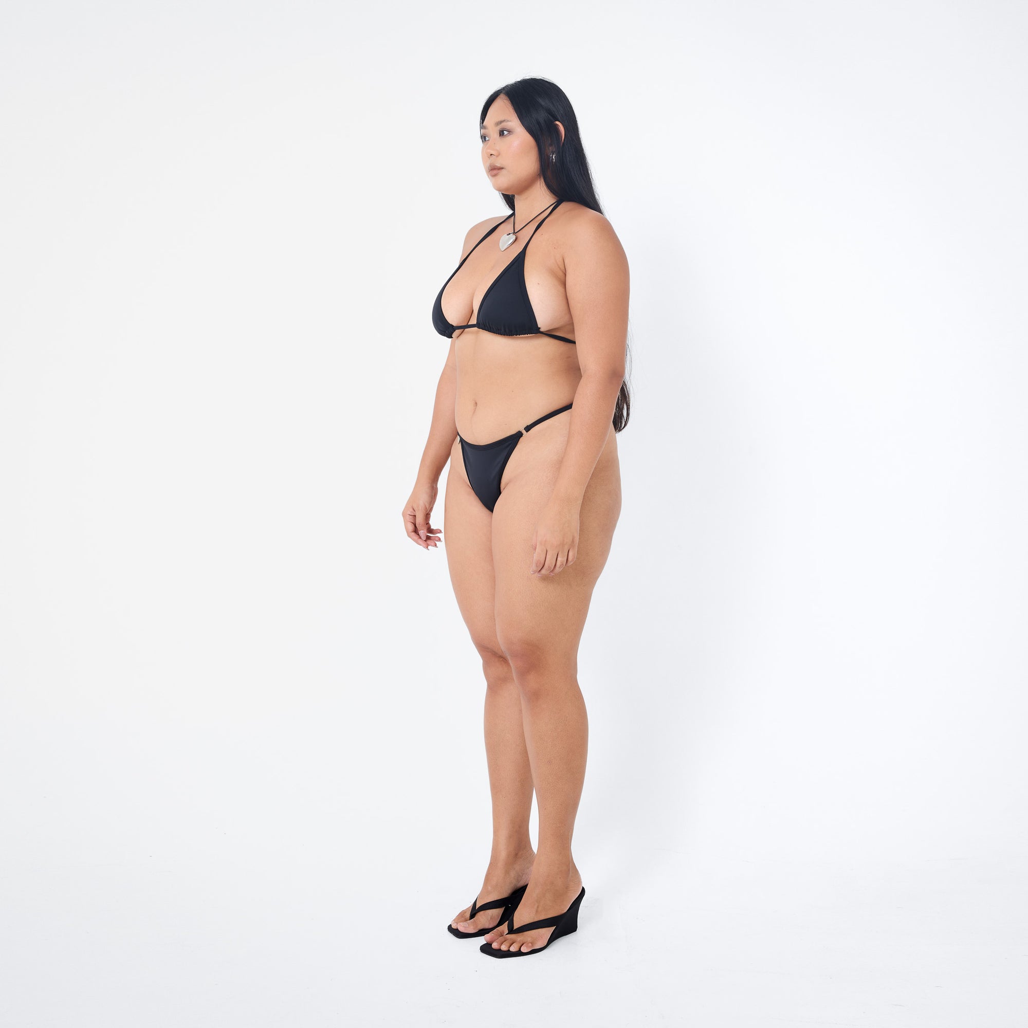 Arthur Apparel strappy bikini bottom in black with silver heart charm