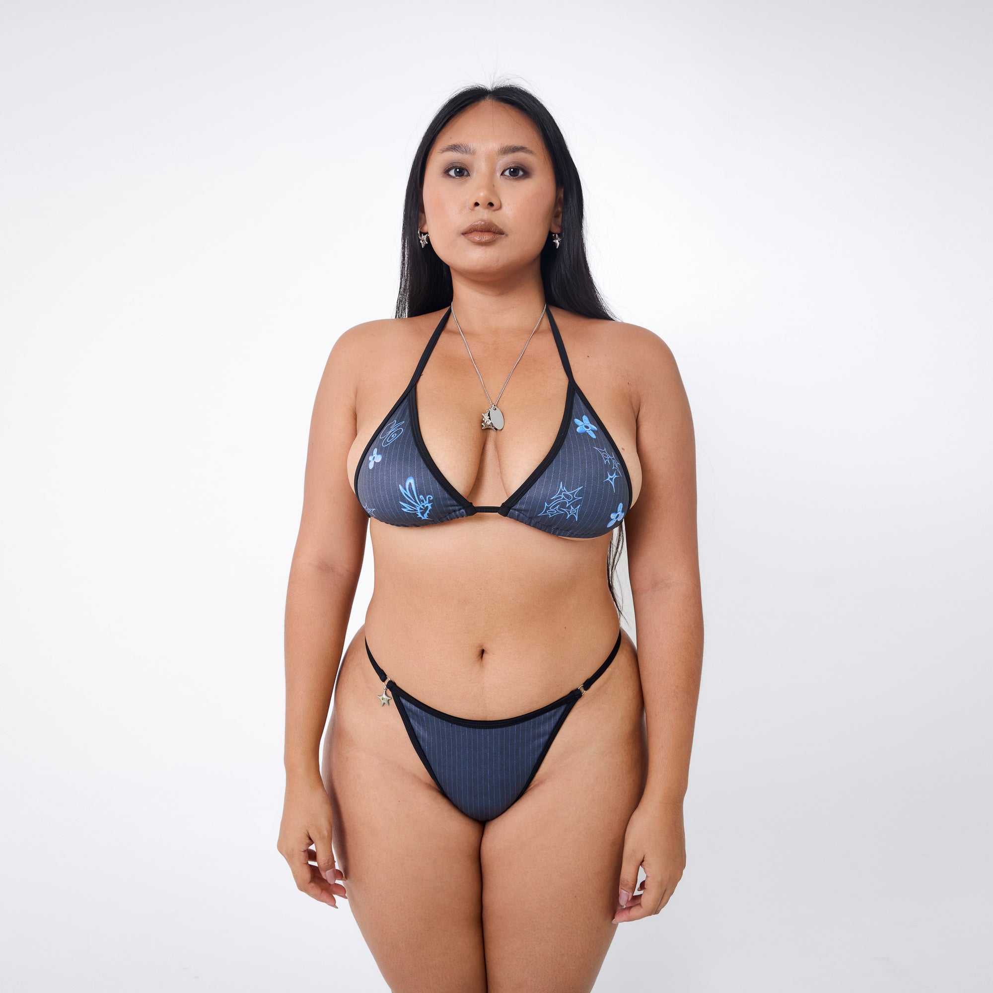 Arthur Apparel triangle bikini top with halter ties in black and blue print