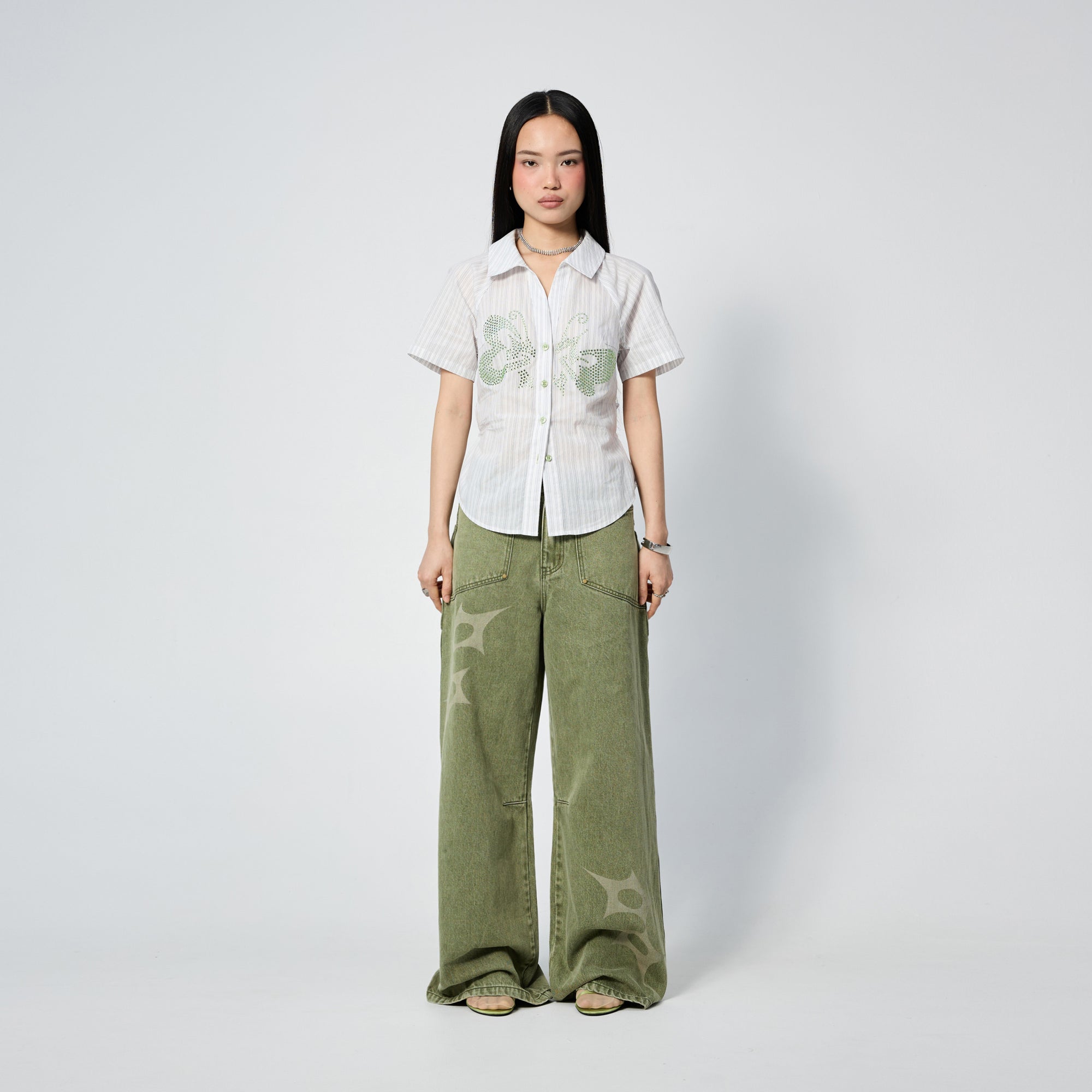 Arthur Apparel green straight leg jeans with stars print