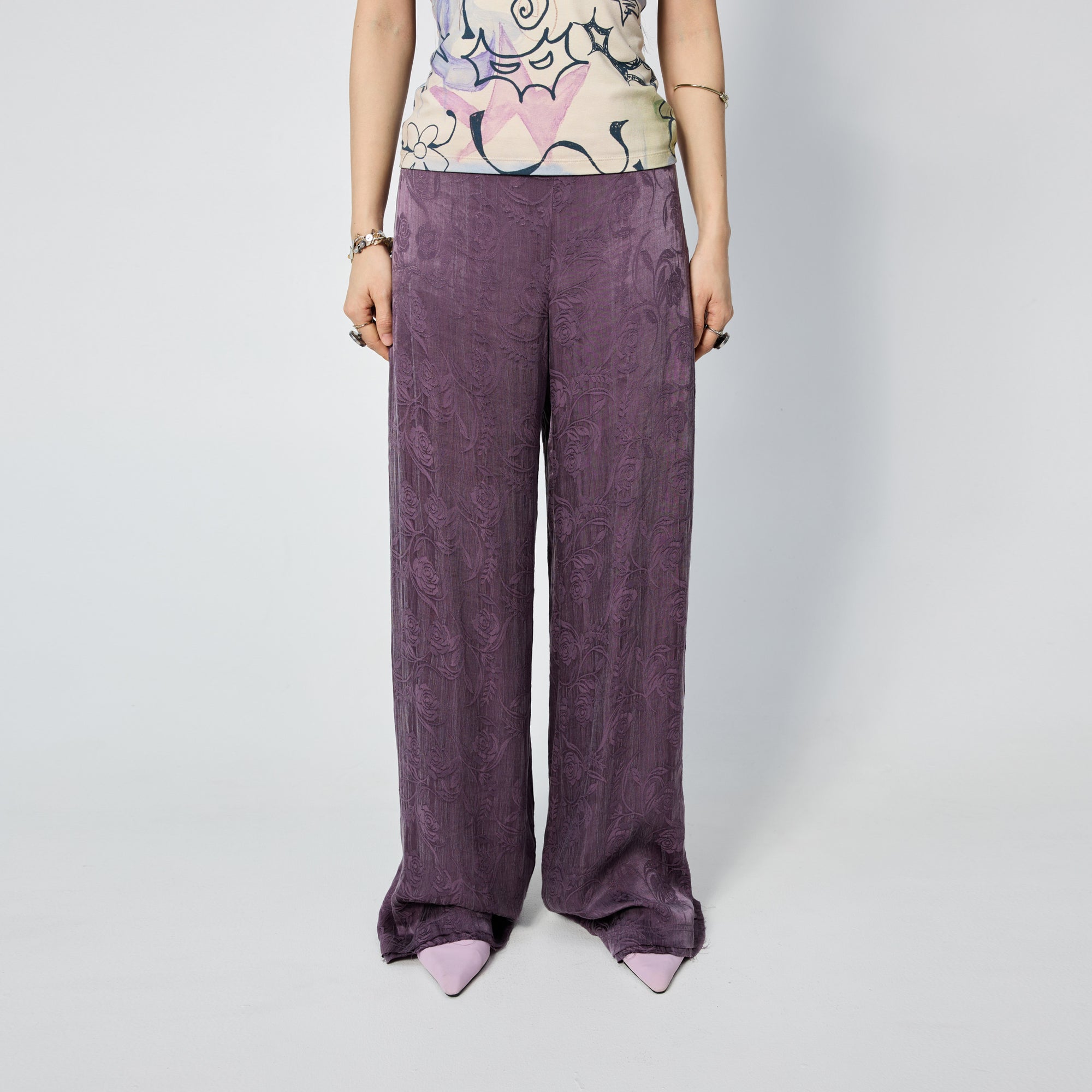 Arthur Apparel purple straight leg pant with frayed hem and roses print