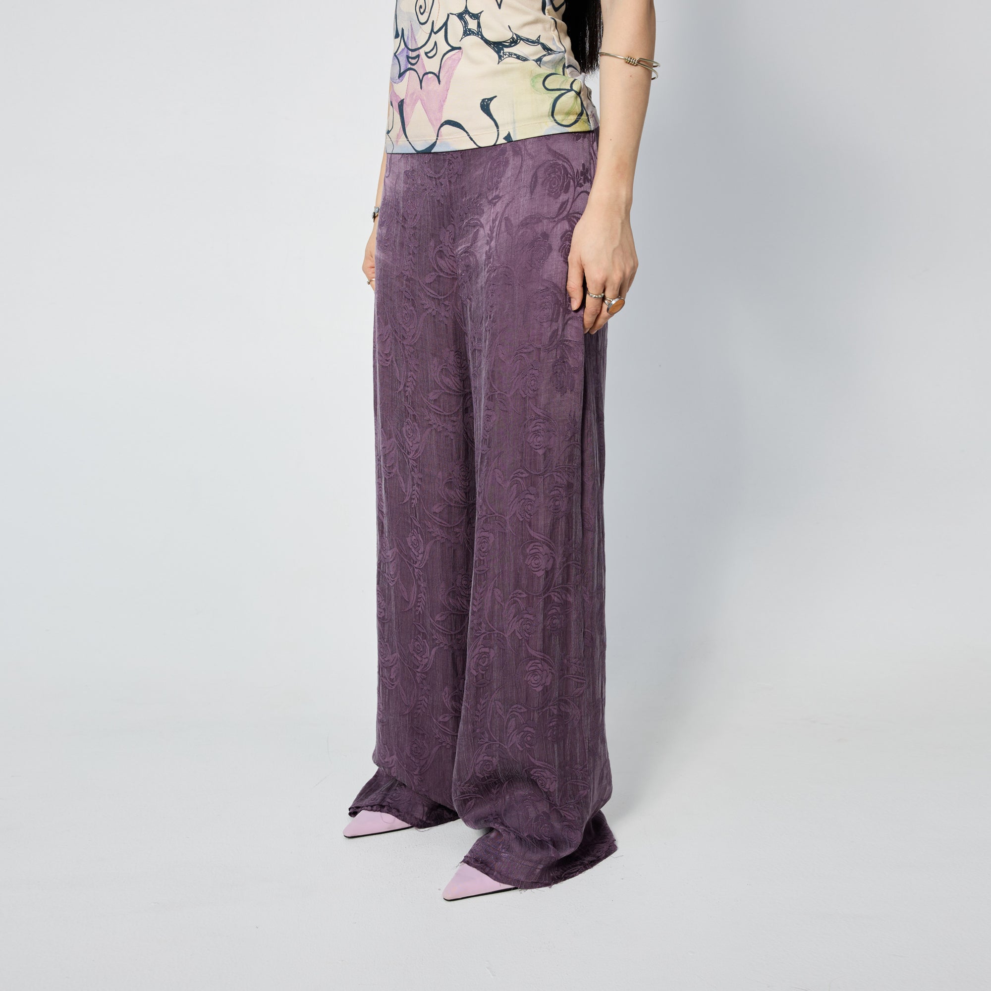 Arthur Apparel purple straight leg pant with frayed hem and roses print